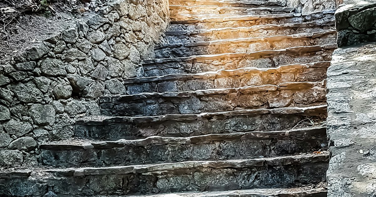 Stone steps climbing a steep hillside, the kind of pedestrian stairway that connects streets in Beachwood Canyon