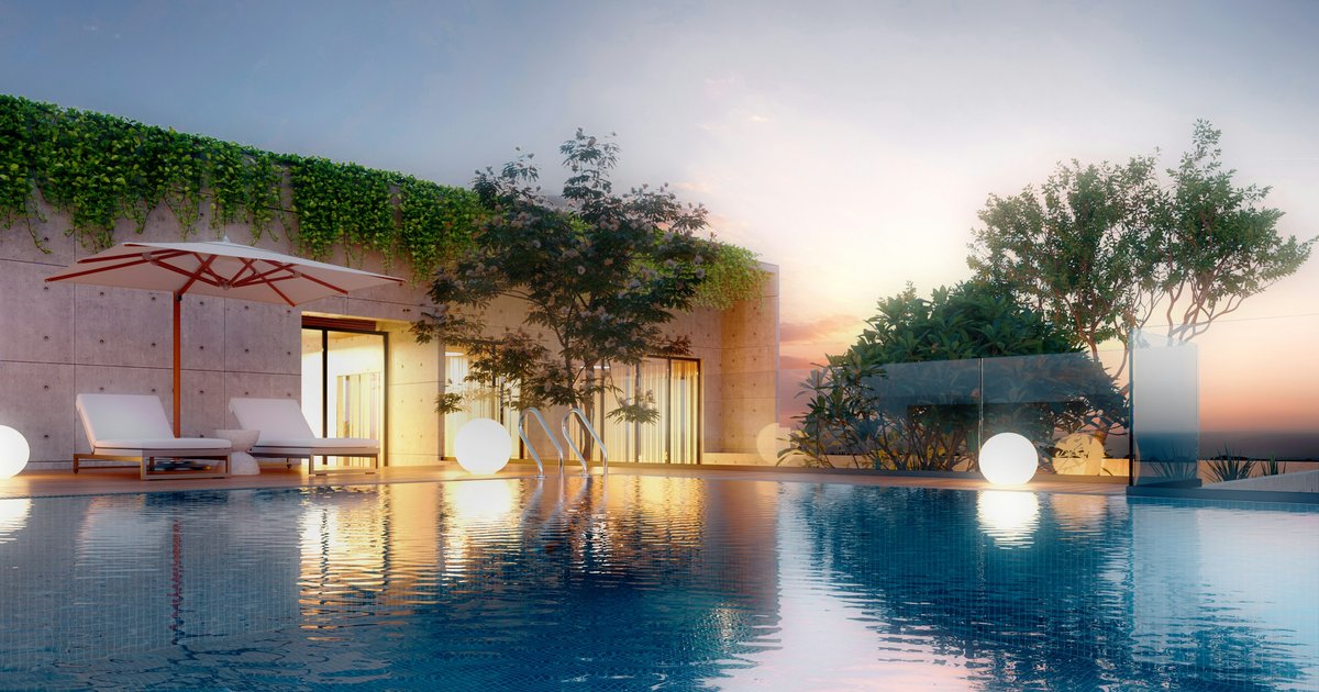 Rooftop-style infinity pool at sunset with lounge chairs, the kind of resort-grade outdoor amenity common to Bel Air Crest compounds