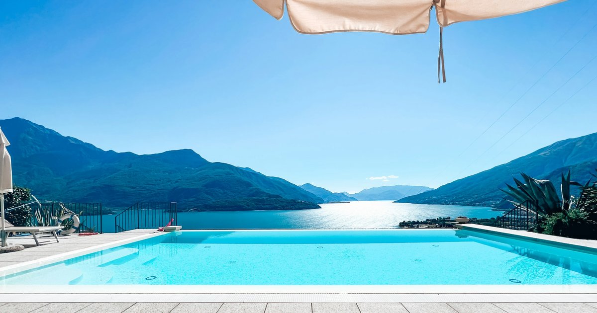 A large swimming pool with a mountain view, characteristic of Calabasas's gated hillside communities