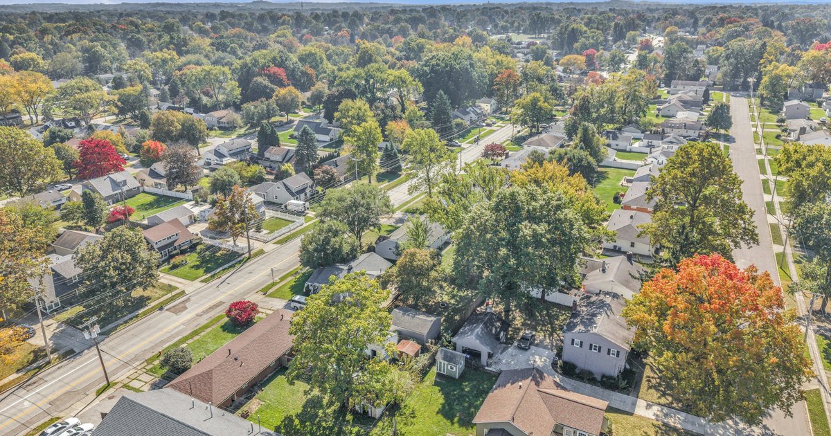 A Texas neighborhood with homes in late autumn light, illustrating the year-end timing decision DFW buyers and sellers face