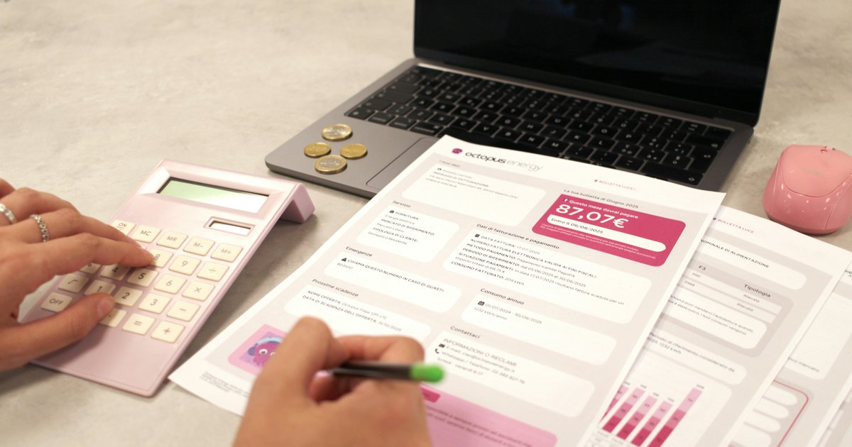 A person reviewing mortgage documents and financial calculations at a desk