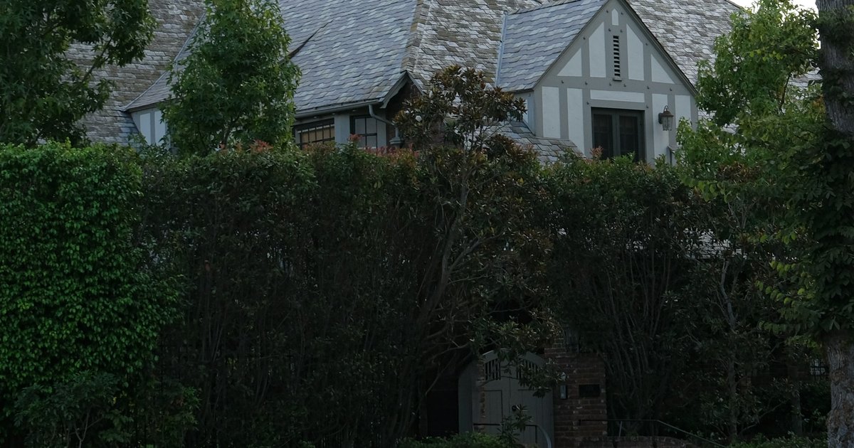 Tudor-style Los Angeles home with lush greenery and mature trees, representative of hillside and canyon properties covered by LA County recording requirements