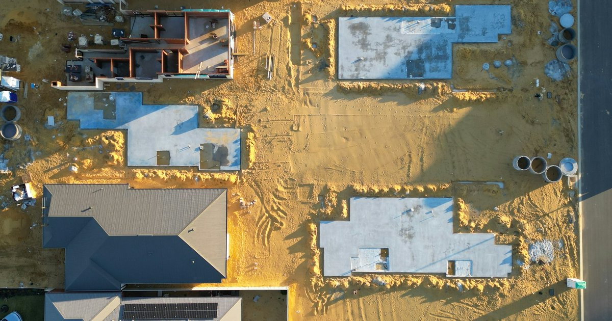 Aerial view of a new-construction subdivision in progress, the kind of production-home supply reshaping Forney's citywide median