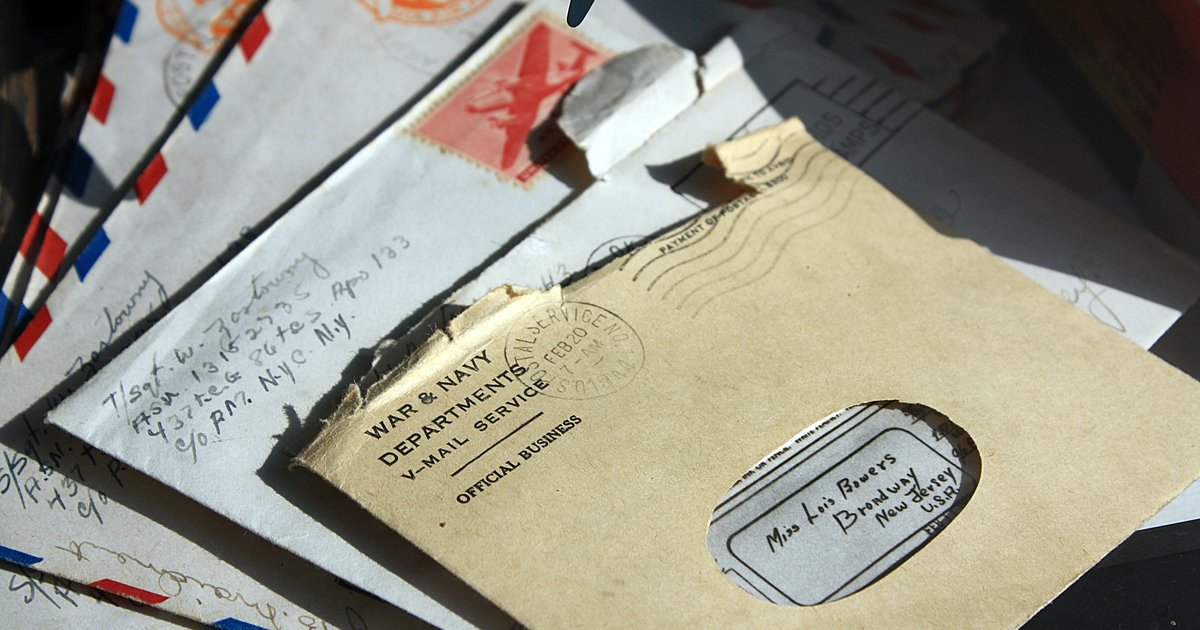 A Texas homeowner reviewing certified mail from their HOA at a kitchen table