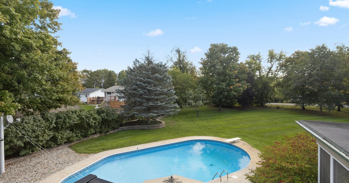 Backyard swimming pool and patio typical of the larger, pool-equipped homes in Murphy's Hunters Landing subdivision