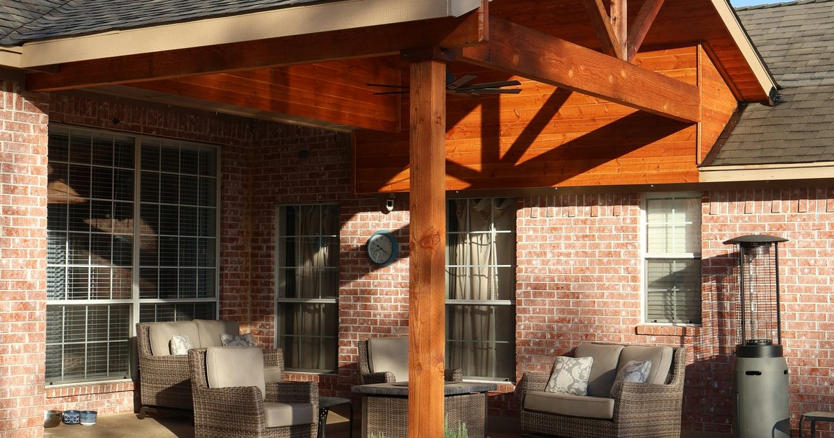 A recently built North Texas home with landscaped front yard and attached garage on a quiet suburban street