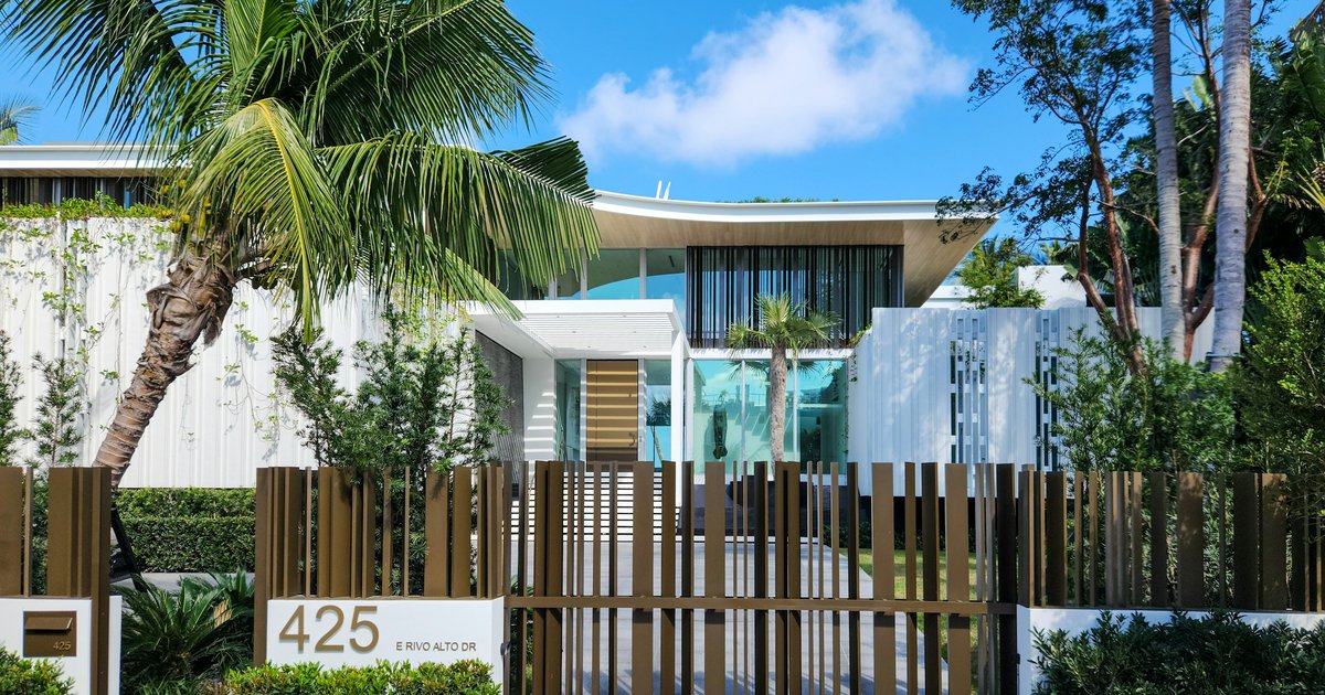 A gated luxury home in Los Angeles with palm trees, representing the type of property where seller-paid rate buydowns are negotiated in the 2026 market
