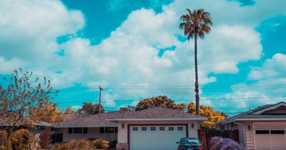 Ranch-style home with attached garage on a Sherman Oaks flats street