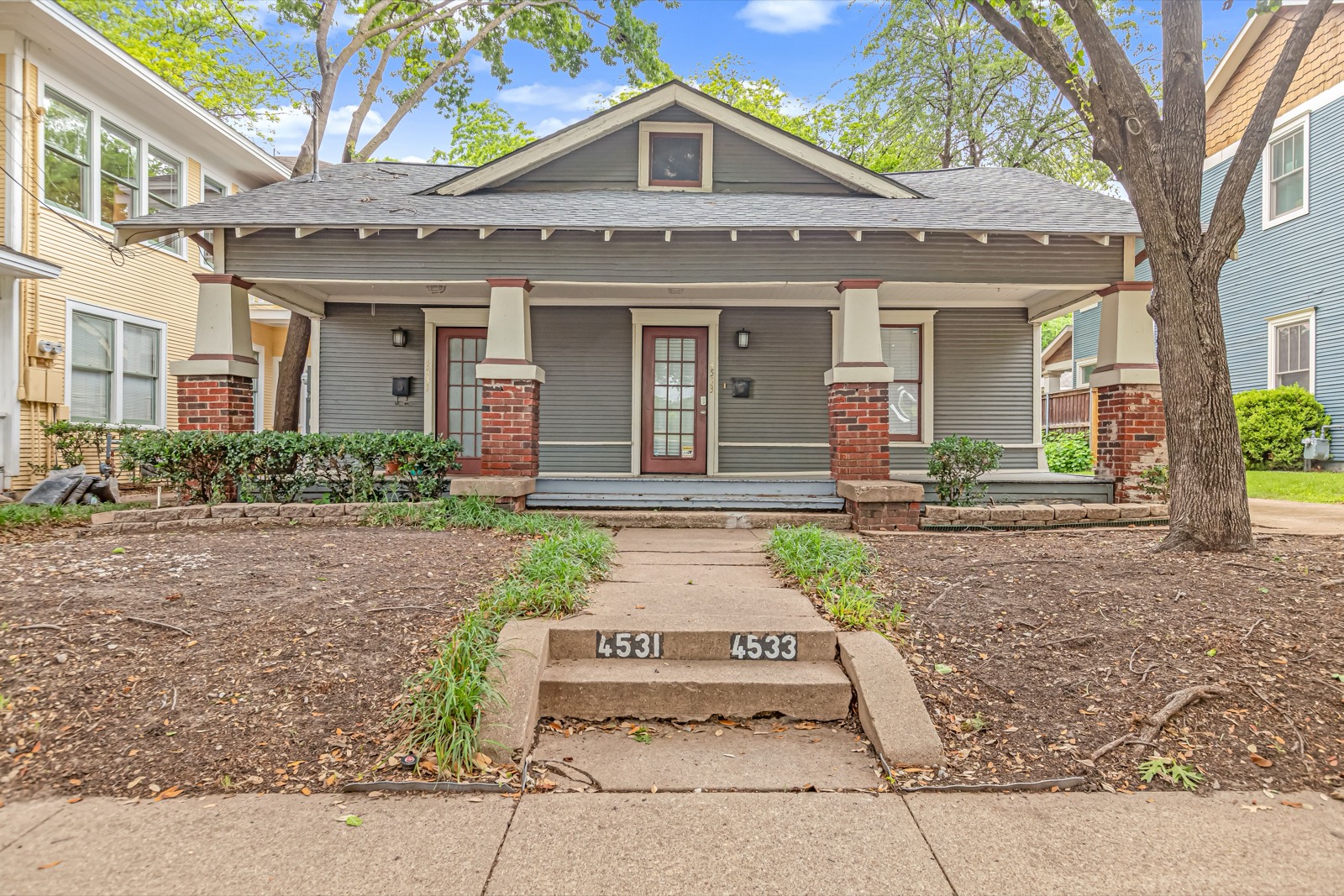 Exterior of the 1923 duplex at 4533 Worth Street, across the street from Buckner Park in Dallas's Peak's Suburban Addition